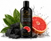 Pink Grapefruit Activated Charcoal Body Wash in a matte black bottle with botanical ingredients